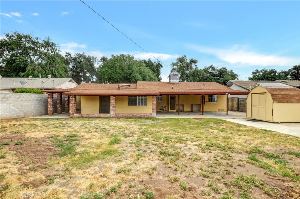 2734 Serrano Road North San Bernardino, CA 92405 - Photo 22 of 25 a front view of a house with a garden