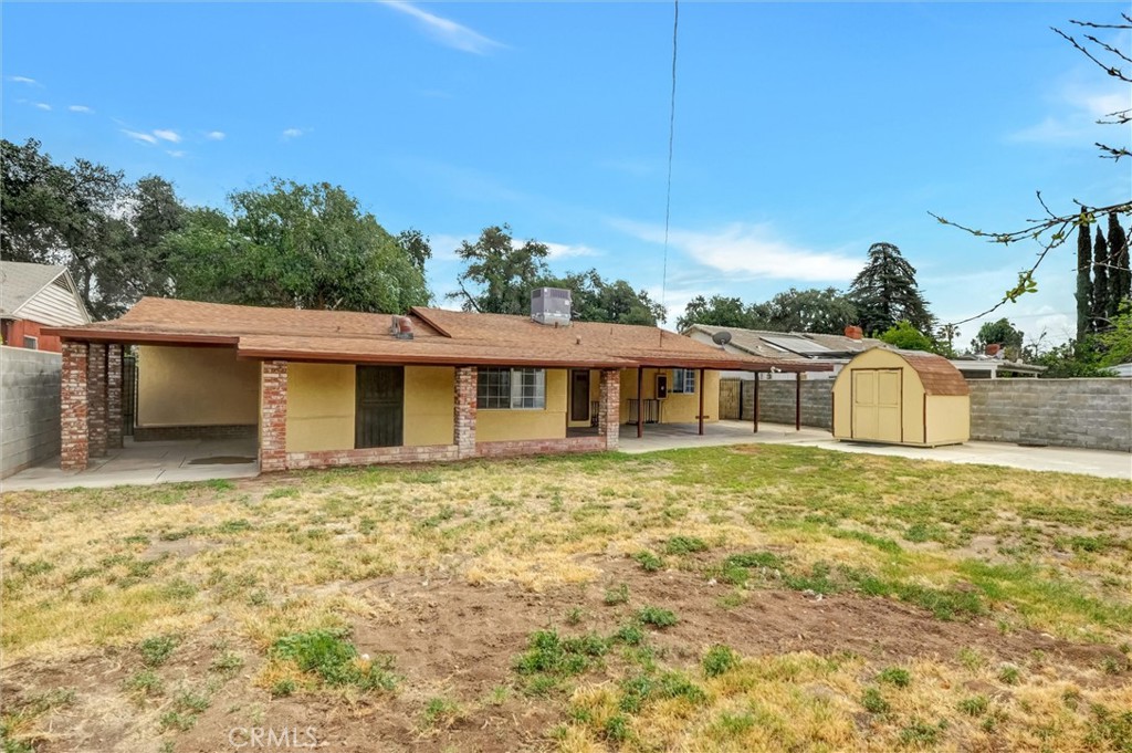 2734 Serrano Road North San Bernardino, CA 92405 - Photo 23 of 25 a front view of a house with a garden