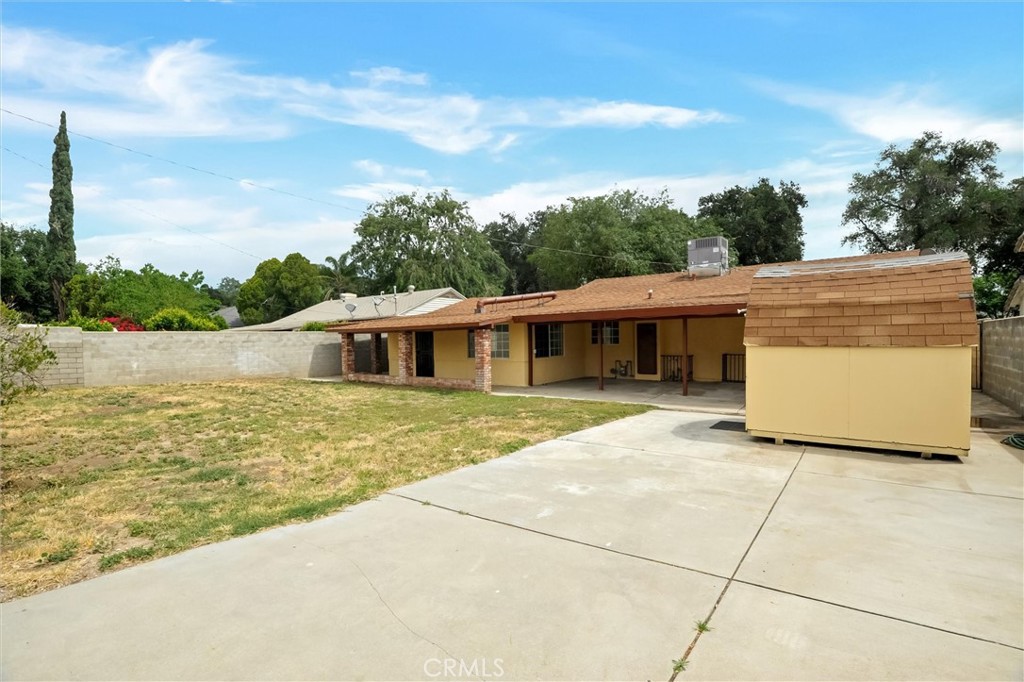 2734 Serrano Road North San Bernardino, CA 92405 - Photo 24 of 25 a front view of a house with a yard