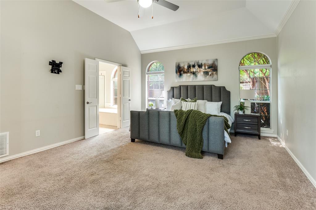 3840 Azure Lane Addison, TX 75001 - Photo 15 of 36 Bedroom with carpet flooring, lofted ceiling, and ceiling fan