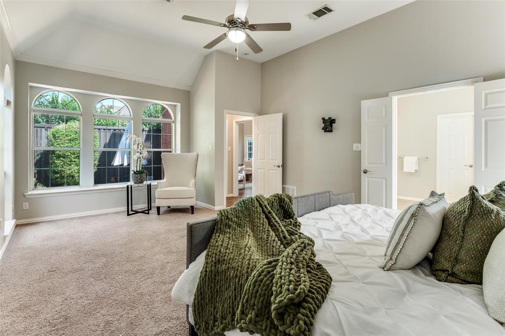 3840 Azure Lane Addison, TX 75001 - Photo 16 of 36 Carpeted bedroom featuring a ceiling fan and vaulted ceiling