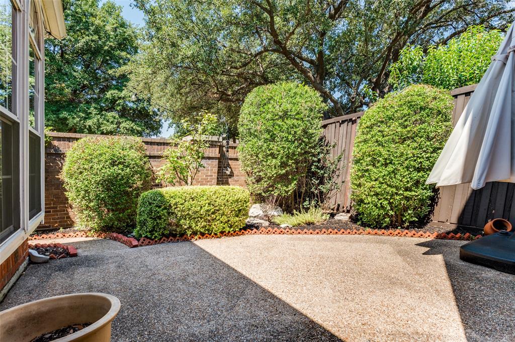 3840 Azure Lane Addison, TX 75001 - Photo 24 of 36 Fenced backyard with a patio area