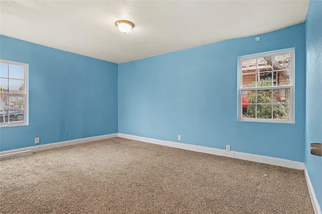 an empty room with windows