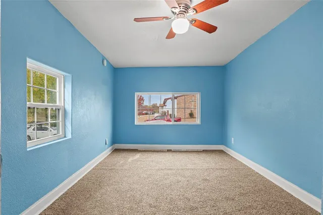 an empty room with windows