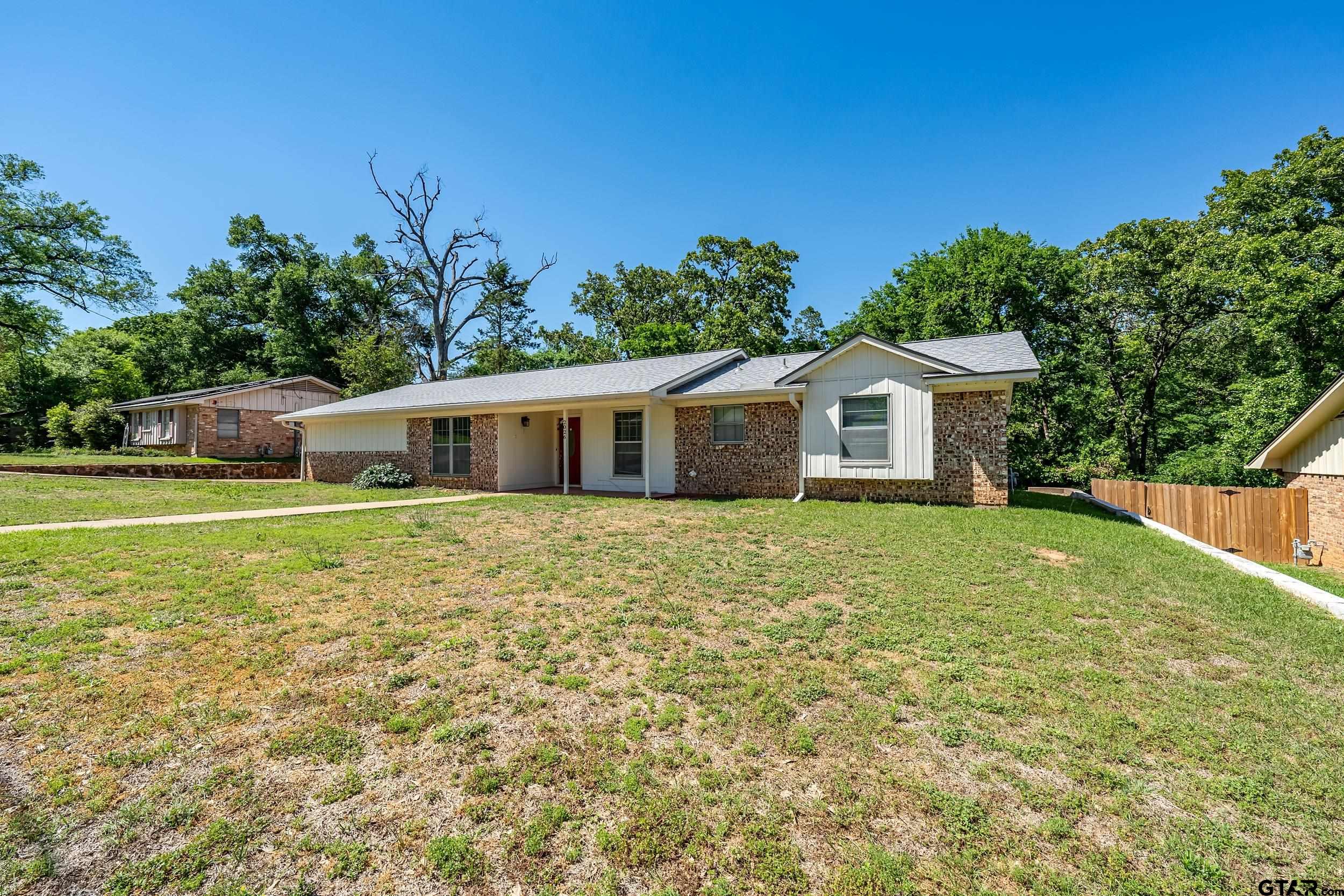 2026 Neeley Street Tyler, TX 75701 - Photo 2 of 26 a front view of house with yard and green space