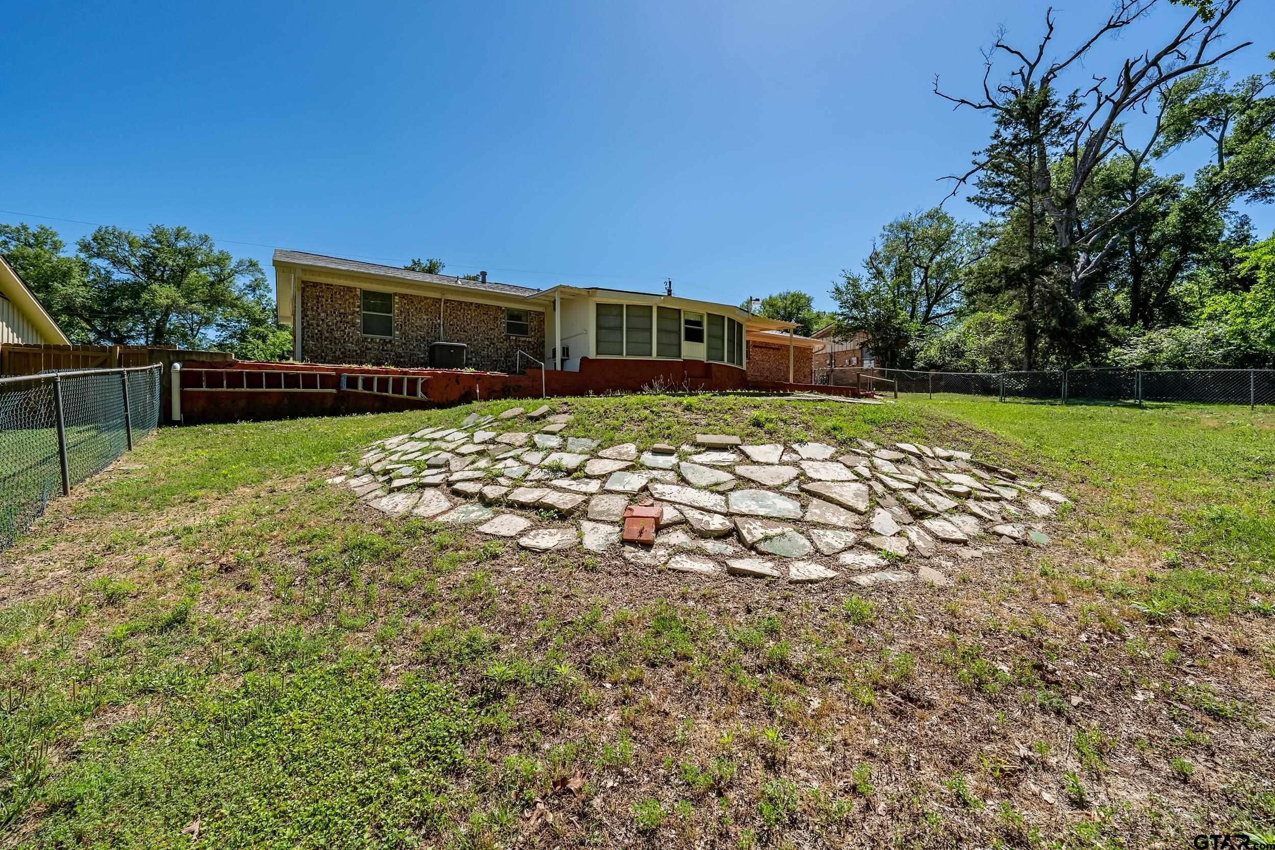 2026 Neeley Street Tyler, TX 75701 - Photo 25 of 26 a view of a backyard