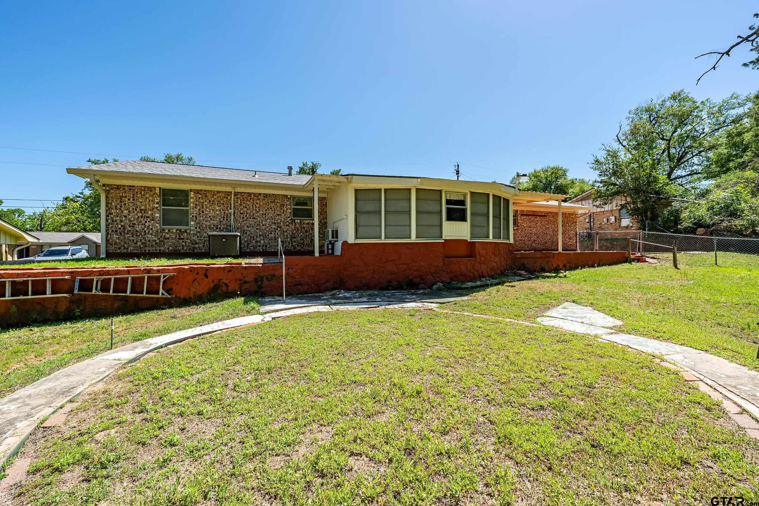 2026 Neeley Street Tyler, TX 75701 - Photo 26 of 26 a front view of a house with a yard