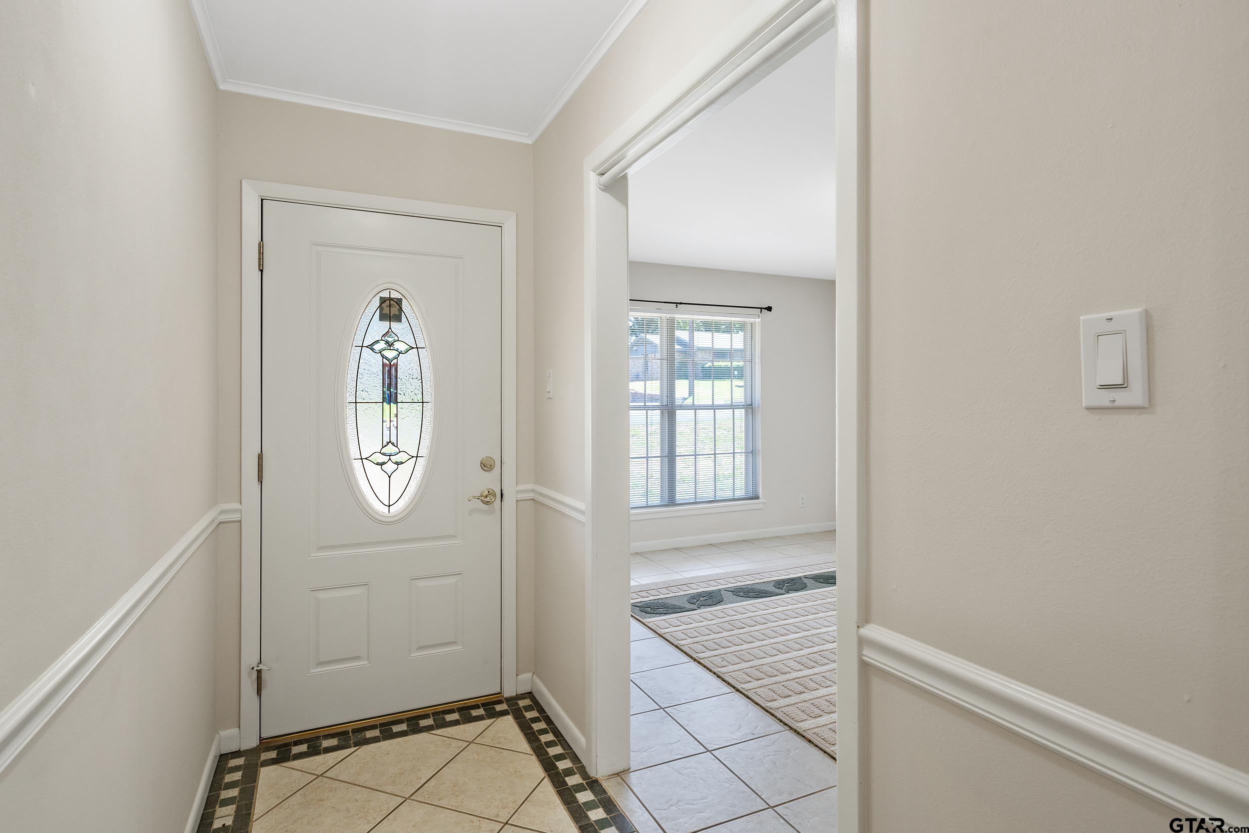 2026 Neeley Street Tyler, TX 75701 - Photo 5 of 26 a view of a livingroom with wooden floor and windows