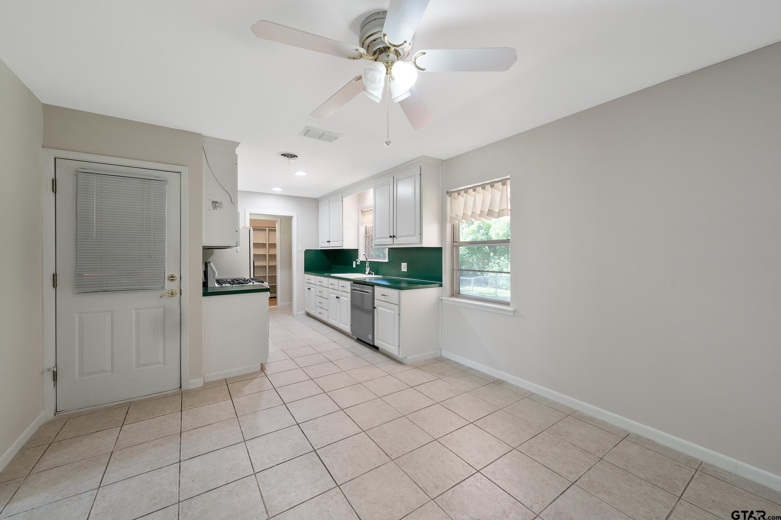 2026 Neeley Street Tyler, TX 75701 - Photo 6 of 26 a view of a kitchen with a sink and a window