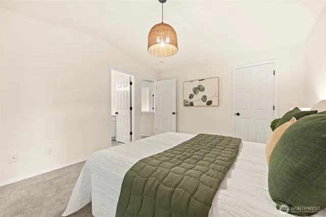 a bathroom with a double vanity sink toilet and shower