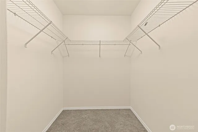 wooden floor in a room with a mirror