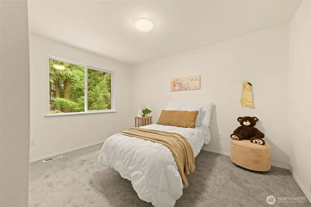 a bedroom with a bed and a closet