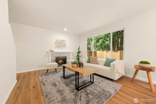 a living room with furniture and a table