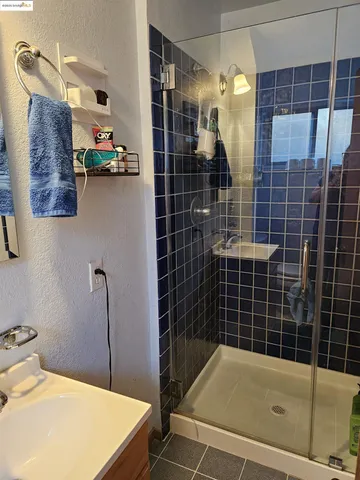 a bathroom with a bathtub and shower