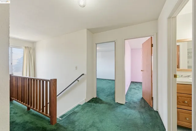 a view of a hallway with a door and yard