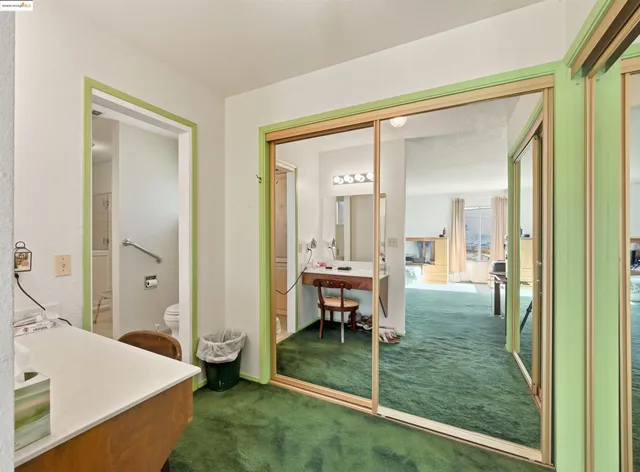 a spacious bathroom with a shower sink and mirror