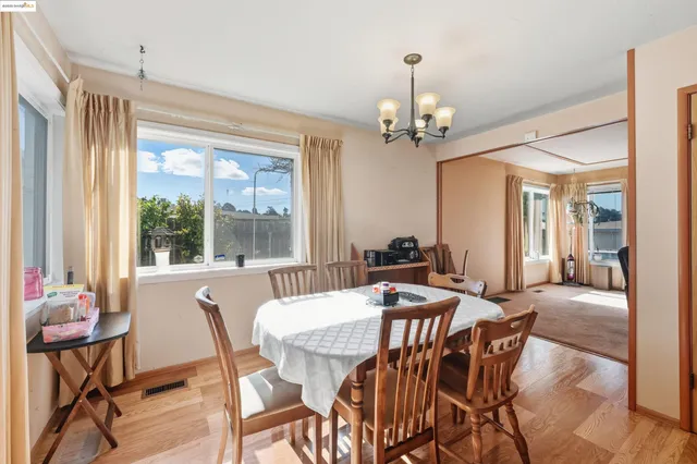a view of a dining room with furniture window and outside view