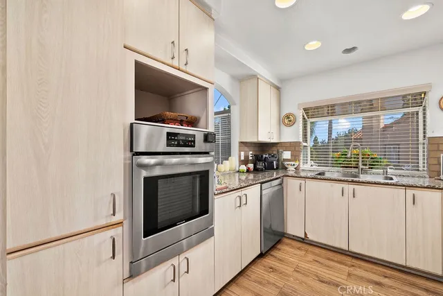 a bedroom with a bed and glass window