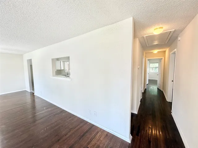 a picture of a bench in front of a gate