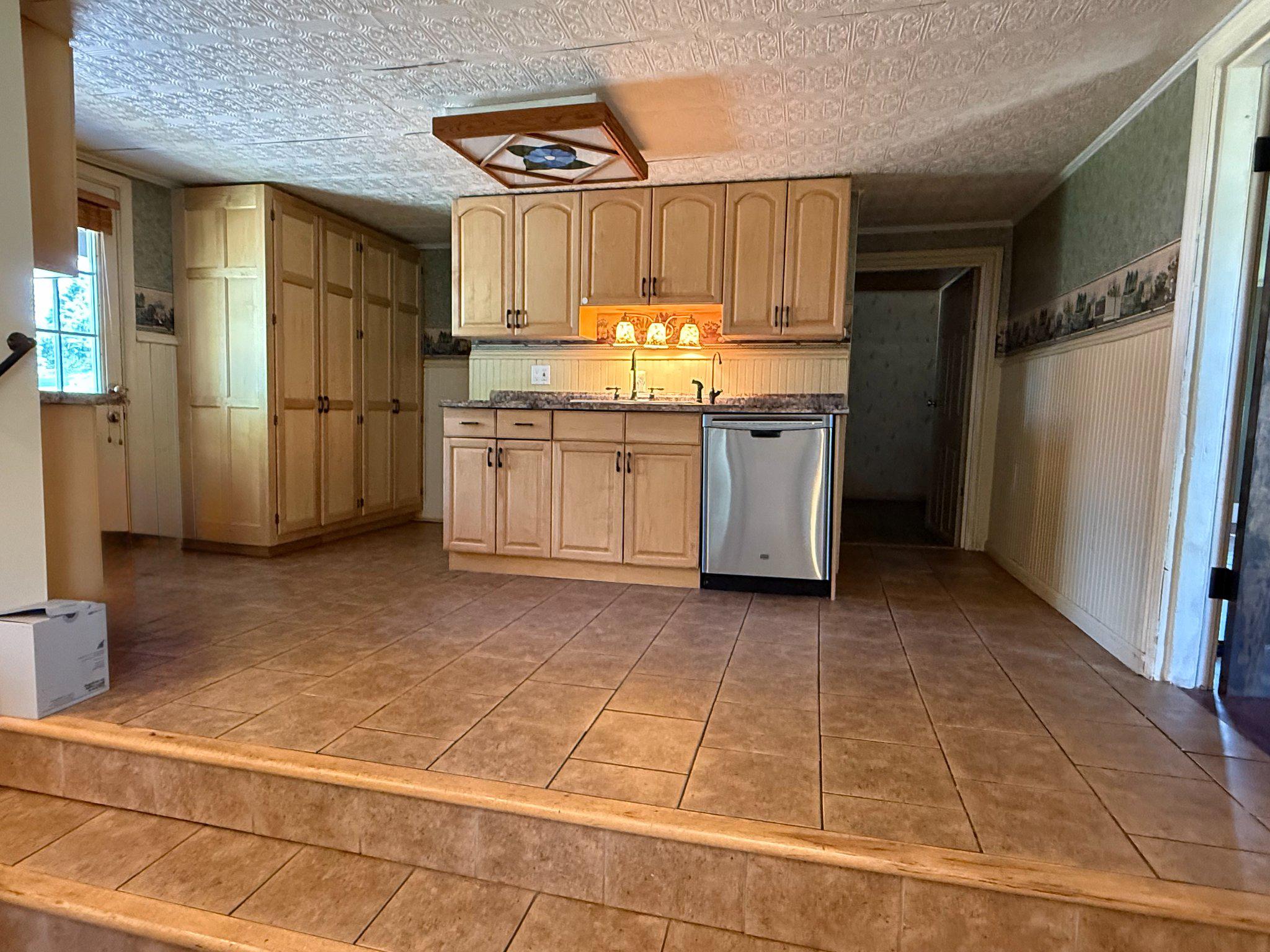 301 Ebenezer Road Lebanon, PA 17046 - Photo 6 of 37 Step up to the kit sink, DW and storage cabinetry