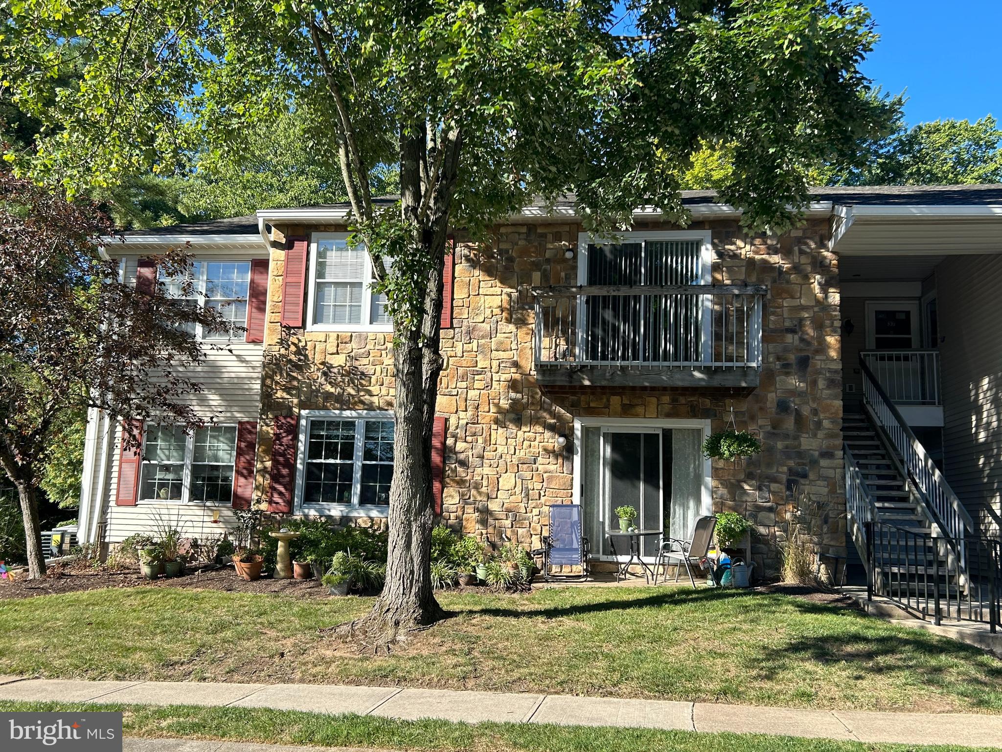 35 Coral Tree Court Lawrence Township, NJ 08648 - Photo 1 of 13 front view of a house with a yard