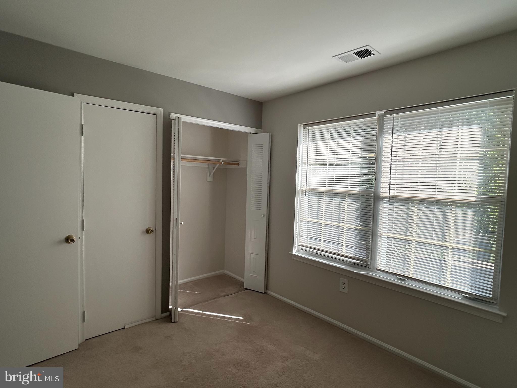35 Coral Tree Court Lawrence Township, NJ 08648 - Photo 13 of 13 a view of an empty room with a window