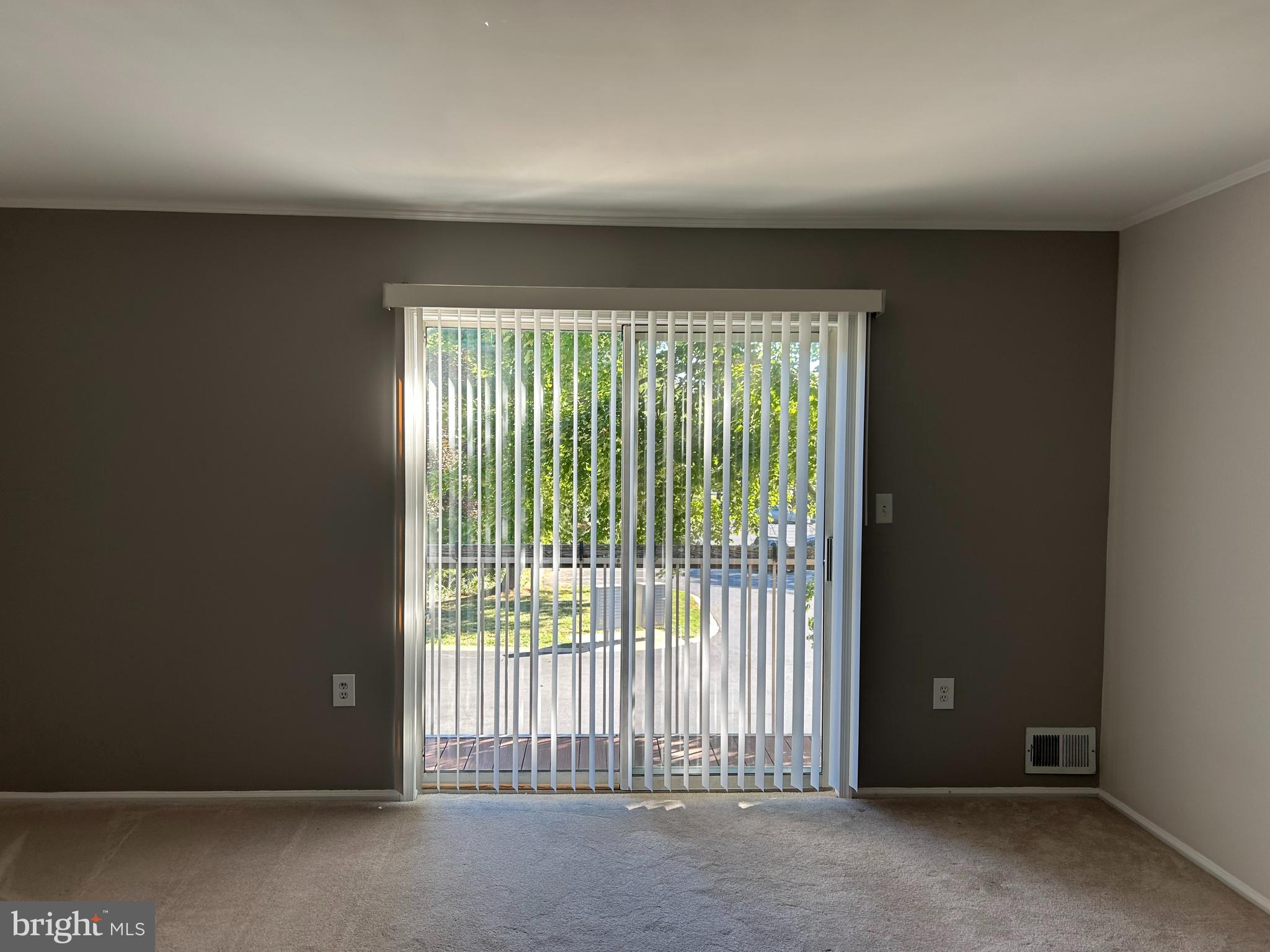 35 Coral Tree Court Lawrence Township, NJ 08648 - Photo 2 of 13 a view of an empty room with a window