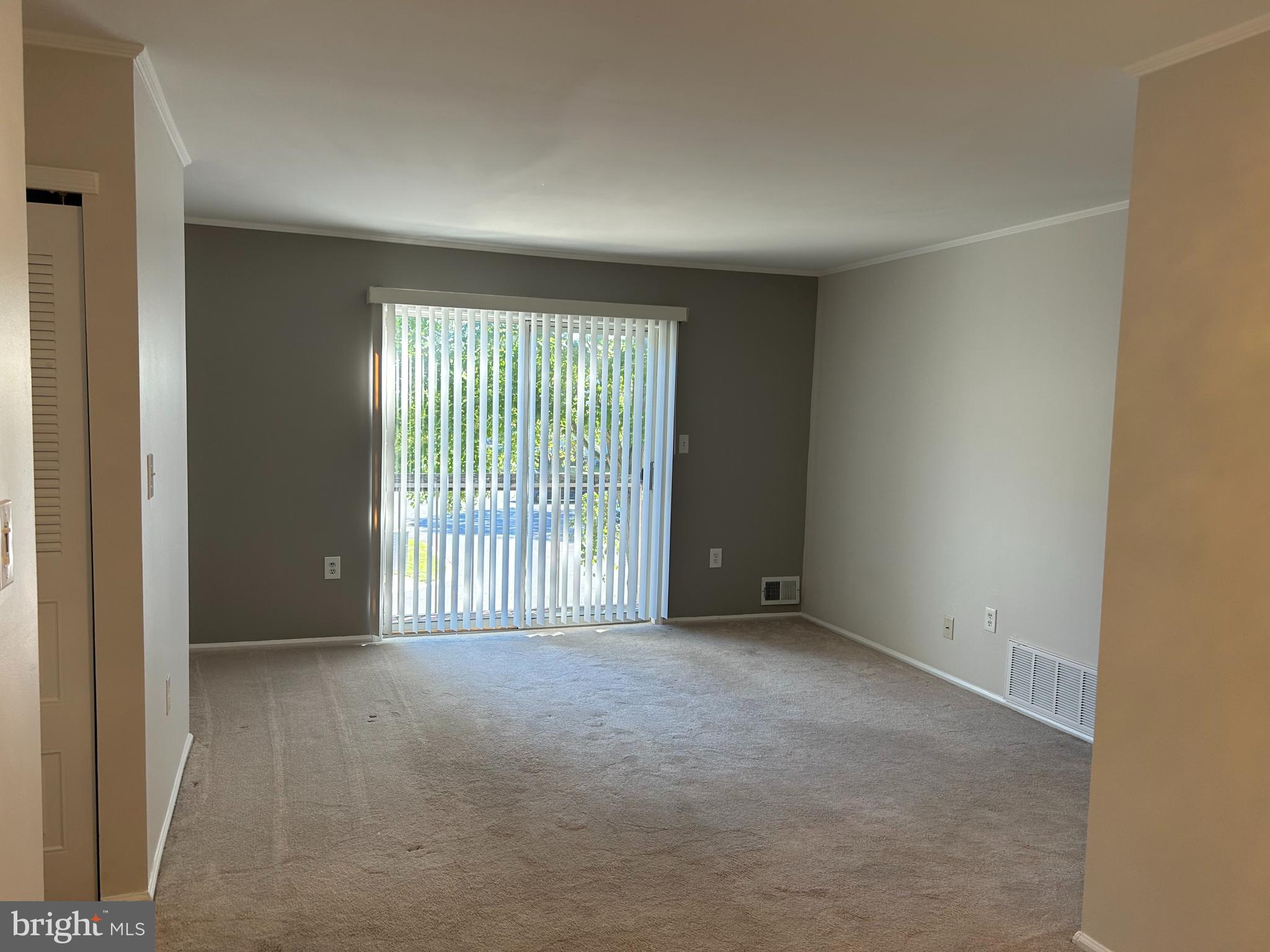 35 Coral Tree Court Lawrence Township, NJ 08648 - Photo 3 of 13 a view of an empty room with a window