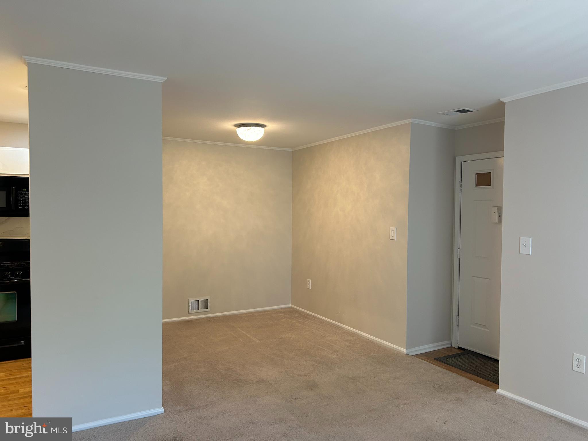 35 Coral Tree Court Lawrence Township, NJ 08648 - Photo 4 of 13 an empty room with windows