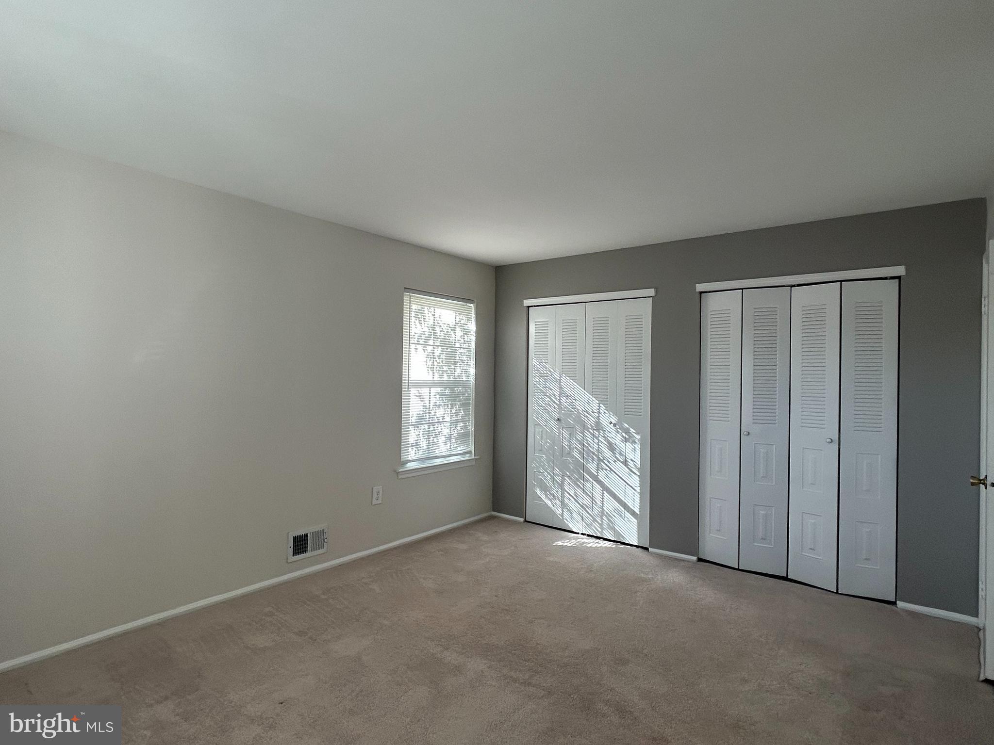 35 Coral Tree Court Lawrence Township, NJ 08648 - Photo 9 of 13 an empty room with windows
