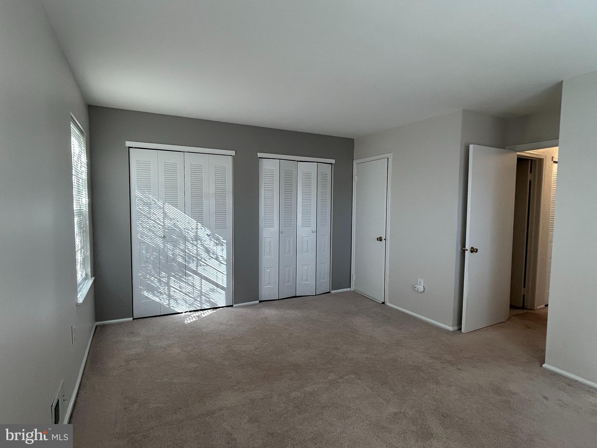 35 Coral Tree Court Lawrence Township, NJ 08648 - Photo 10 of 13 a view of an empty room with windows and closet