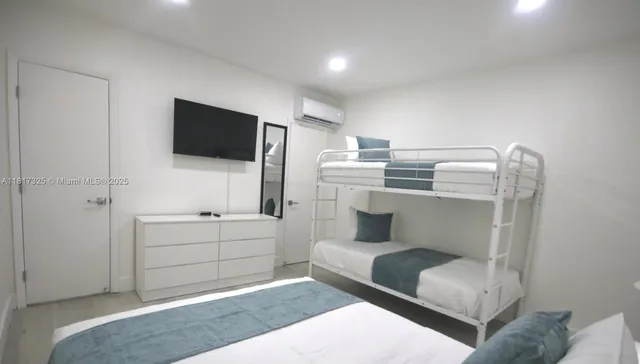 a living room with a couch and a flat screen tv