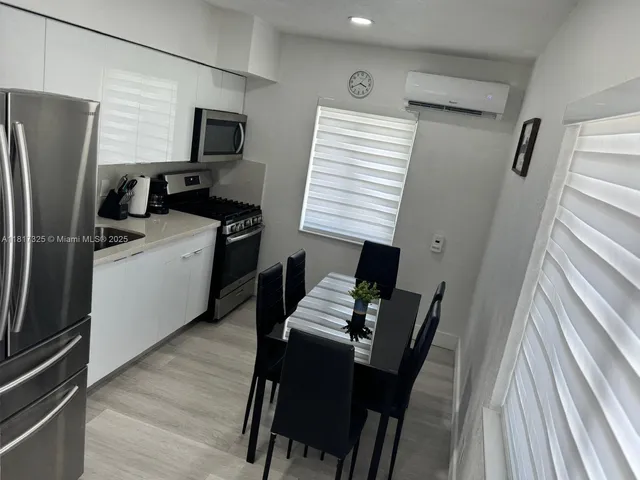 a work place with furniture and wooden floor