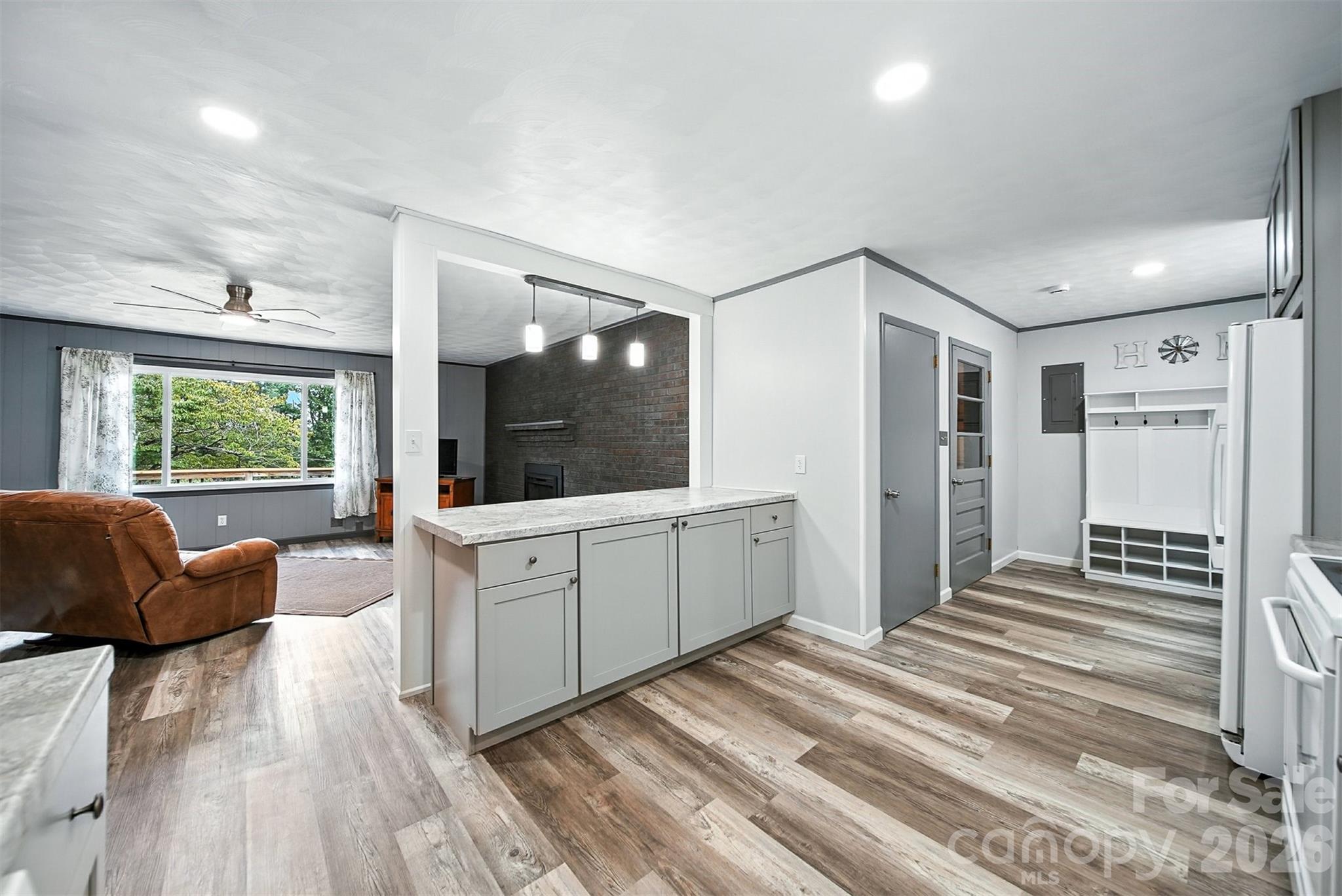4967 Sugar Loaf Road Morganton, NC 28655 - Photo 12 of 37 a large white room with a large window and furniture