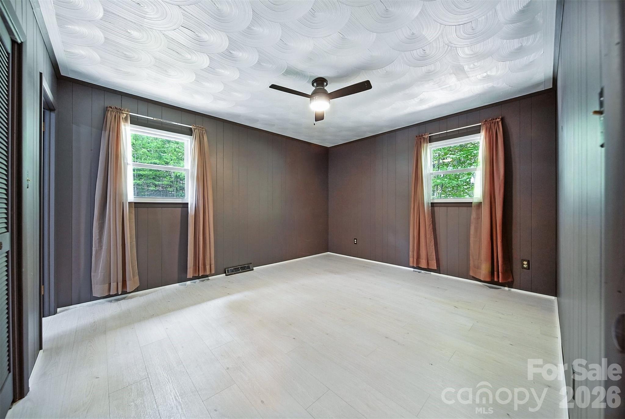 4967 Sugar Loaf Road Morganton, NC 28655 - Photo 18 of 37 a view of a livingroom with a ceiling fan and window