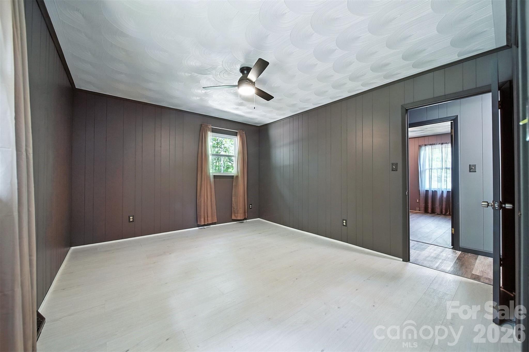 4967 Sugar Loaf Road Morganton, NC 28655 - Photo 19 of 37 a view of a livingroom with a ceiling fan and window