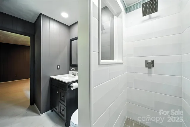 a bathroom with a sink and mirror