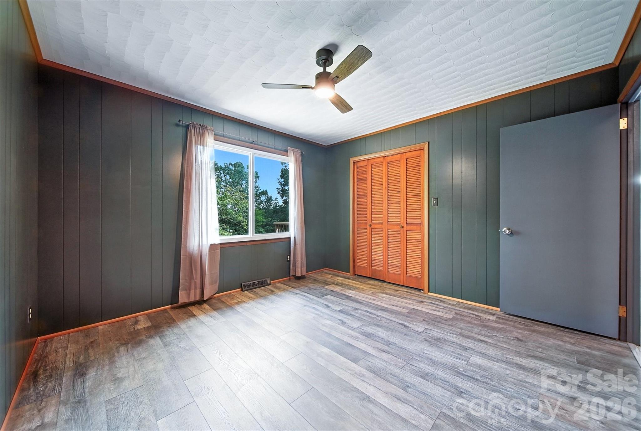 4967 Sugar Loaf Road Morganton, NC 28655 - Photo 24 of 37 a view of an empty room with wooden floor and a window