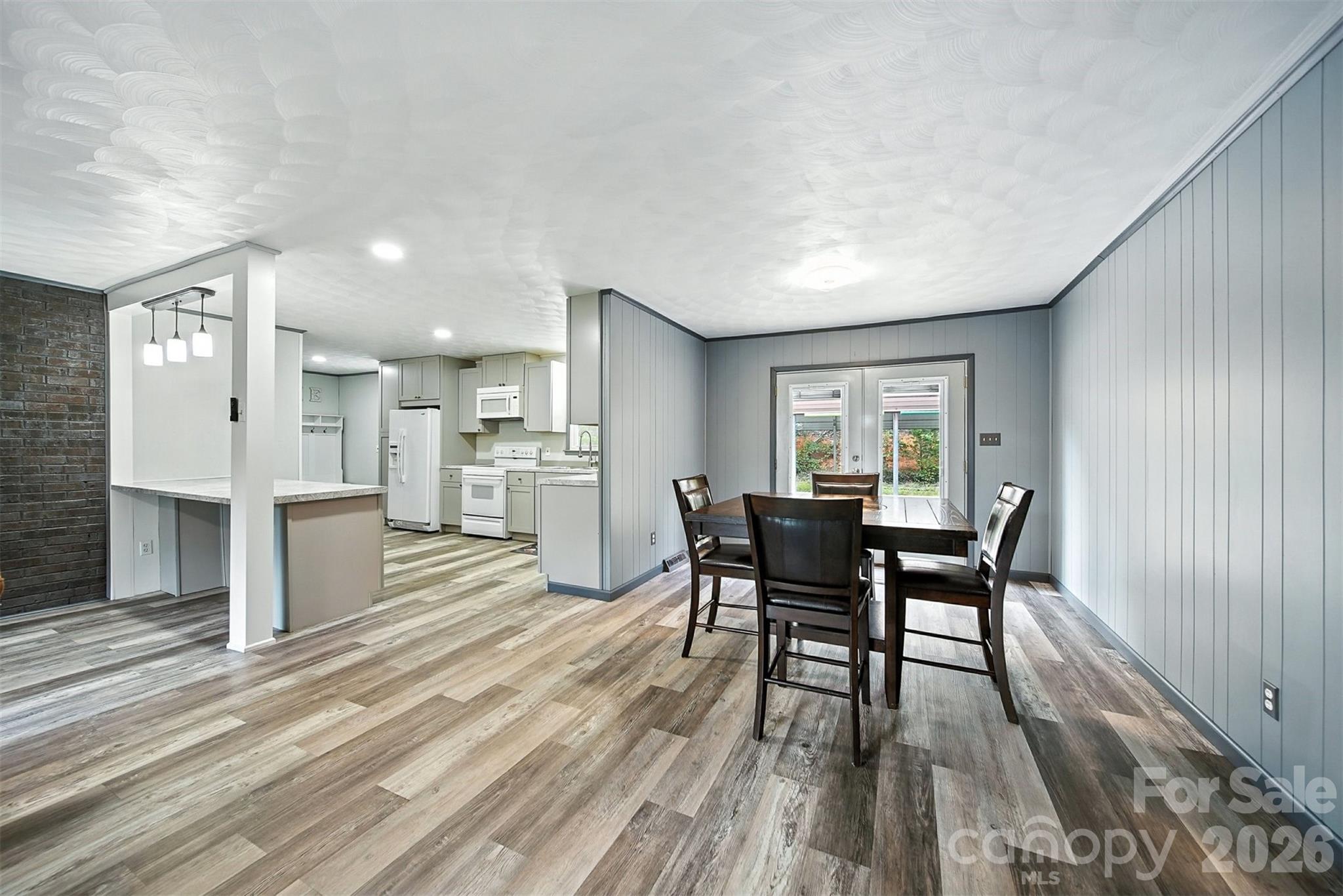 4967 Sugar Loaf Road Morganton, NC 28655 - Photo 3 of 37 a view of a dining room with furniture and wooden floor