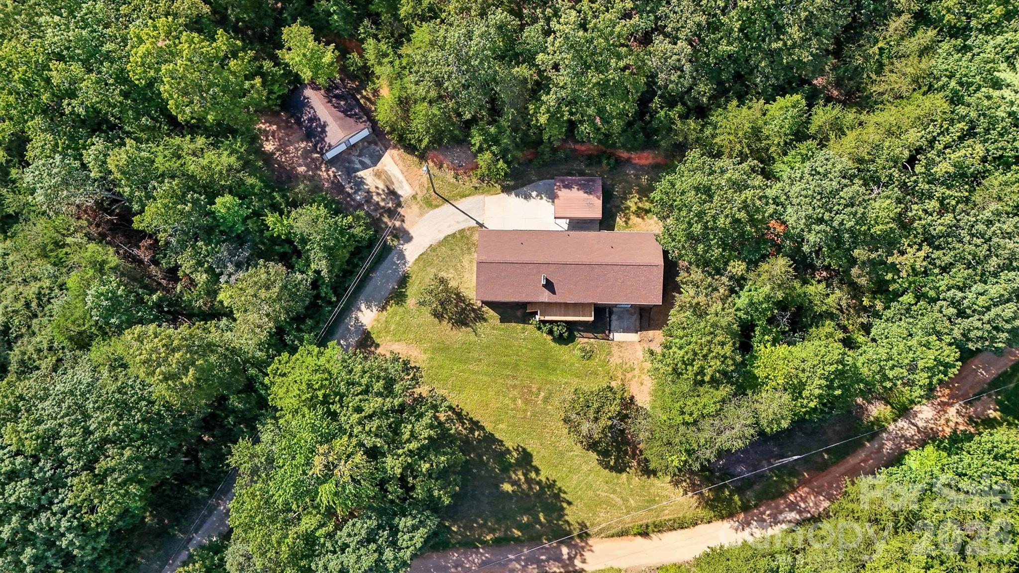 4967 Sugar Loaf Road Morganton, NC 28655 - Photo 34 of 37 an aerial view of a house with a yard swimming pool a yard and a large tree