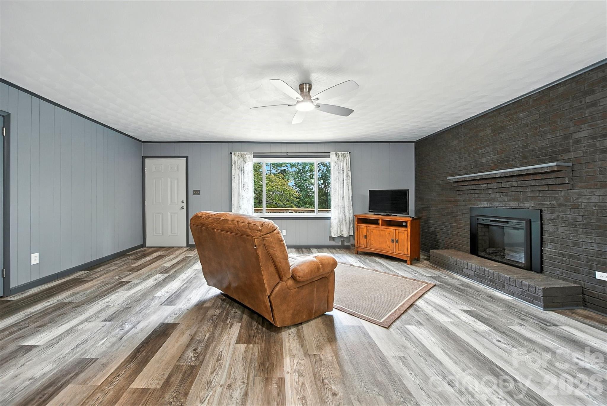 4967 Sugar Loaf Road Morganton, NC 28655 - Photo 8 of 37 a living room with furniture and a fireplace