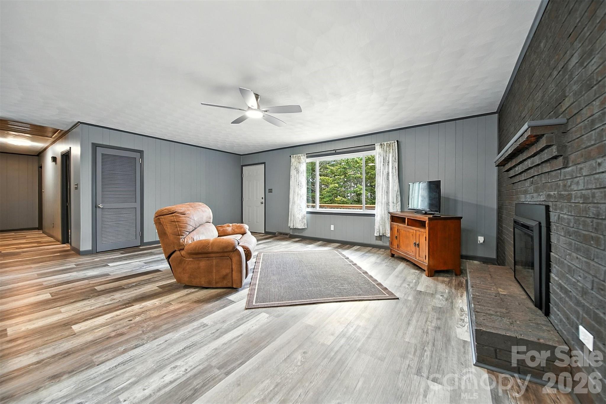 4967 Sugar Loaf Road Morganton, NC 28655 - Photo 9 of 37 a spacious bedroom with a bed and a couch