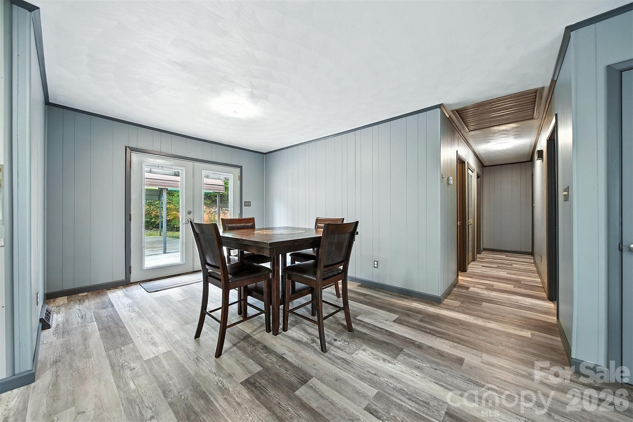 4967 Sugar Loaf Road Morganton, NC 28655 - Photo 10 of 37 a view of a dining room with furniture and wooden floor