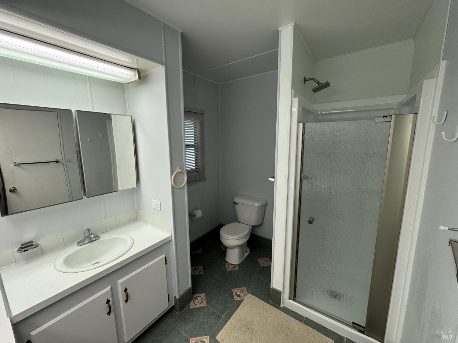 150 Silverado Trail, Unit 29 Napa, CA 94559 - Photo 14 of 18 a bathroom with a granite countertop sink toilet and shower