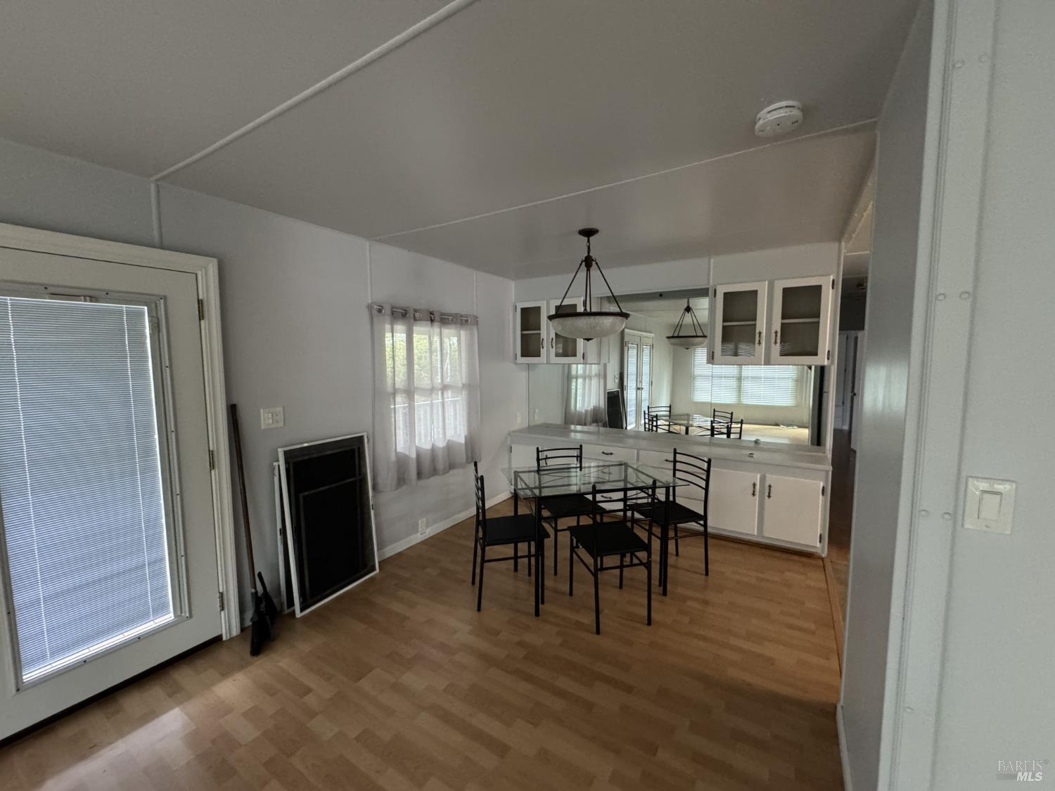150 Silverado Trail, Unit 29 Napa, CA 94559 - Photo 10 of 18 a view of a dining room with furniture and chandelier