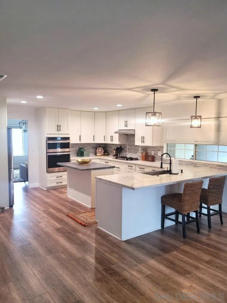33375 Wright Road Menifee, CA 92584 - Photo 23 of 61 a kitchen with a sink a counter top space and appliances