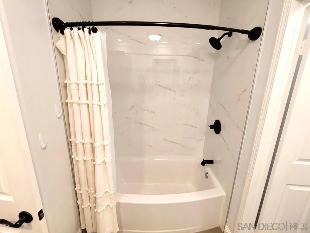 33375 Wright Road Menifee, CA 92584 - Photo 39 of 61 a bathroom with a shower and a tub