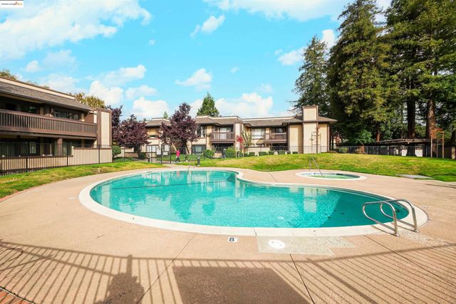 a patio with table and chairs