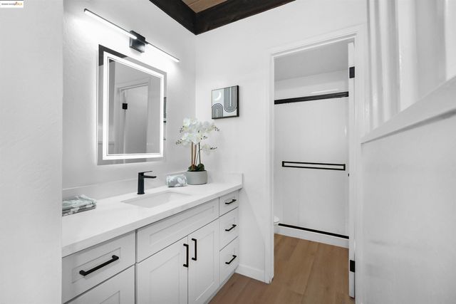 a bathroom with a double vanity sink mirror and