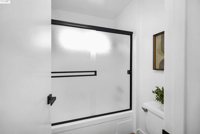 a bedroom with a large bed and a large window